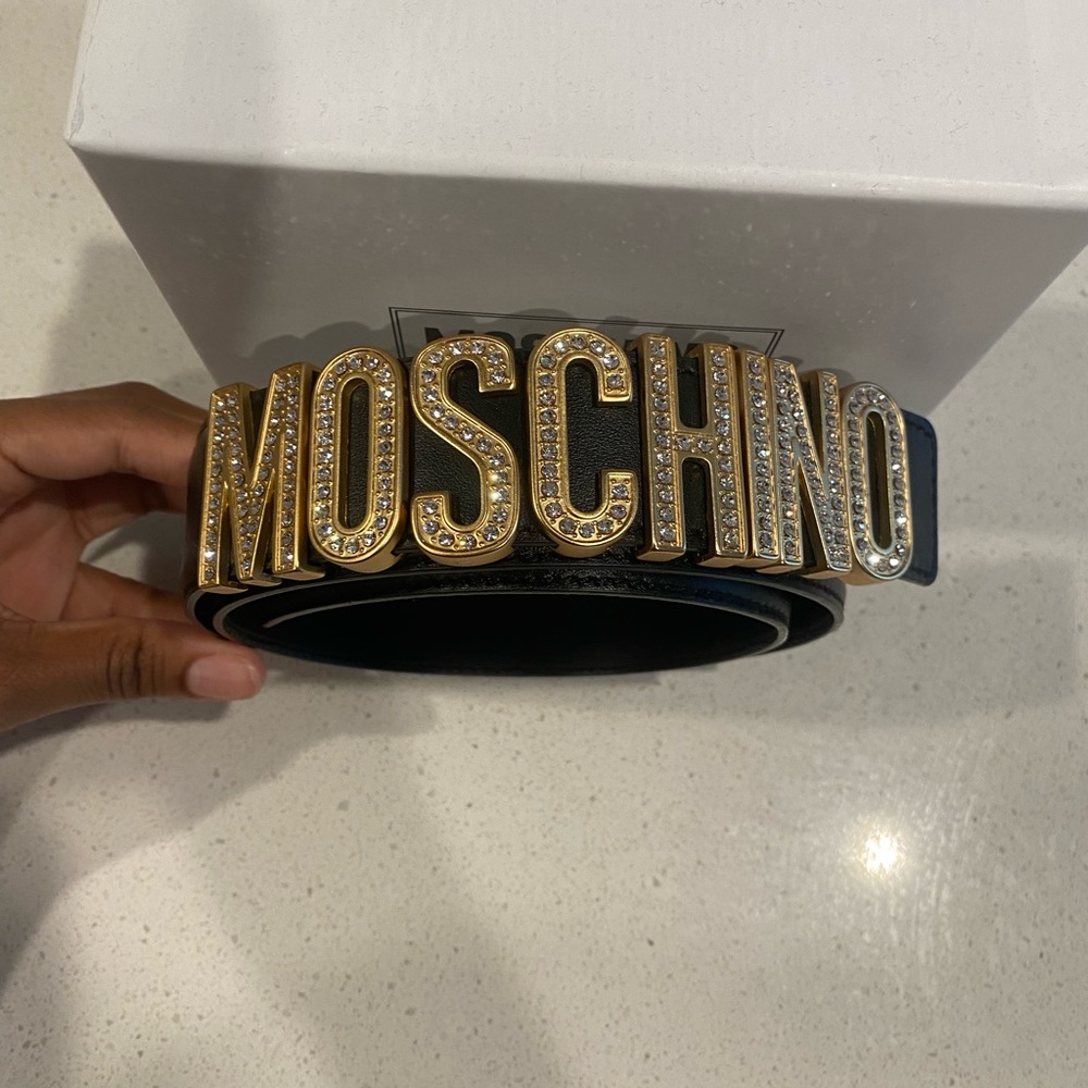 Gold and black moschino belt